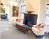 Carpeted living room featuring a fireplace