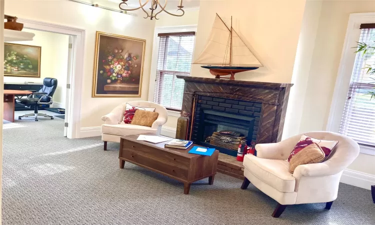 Carpeted living room featuring a fireplace