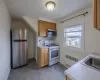 Kitchen with sink, radiator heating unit, and stainless steel appliances