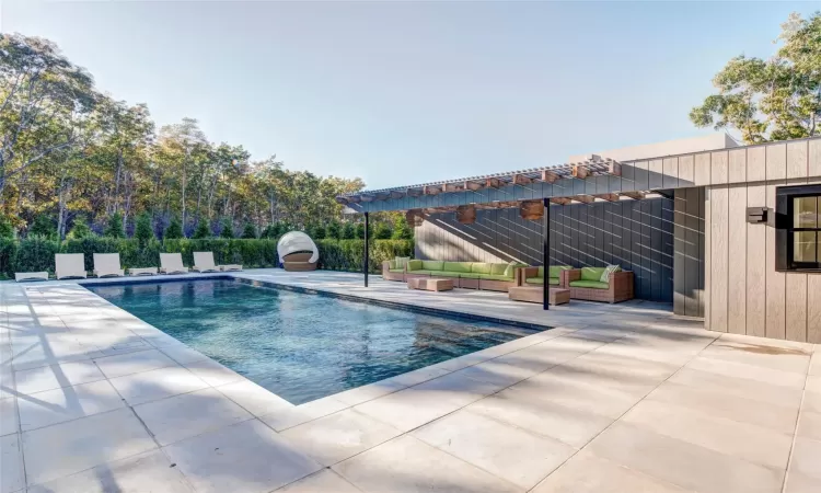 View of swimming pool featuring outdoor lounge area, a patio, and a pergola