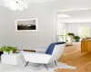 Sitting room with wood-type flooring