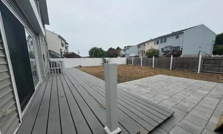 Wooden deck featuring a patio area