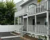 View of exterior entry featuring a balcony