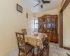 Dining room featuring ceiling fan and light tile patterned floors