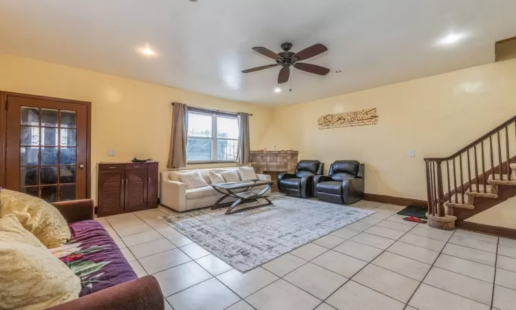 Tiled living room with ceiling fan