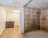 Bathroom with a shower, vanity, and toilet