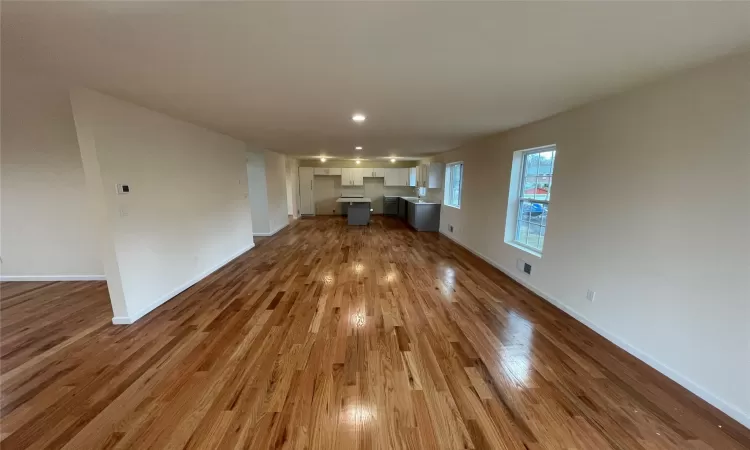 Unfurnished living room with hardwood / wood-style floors