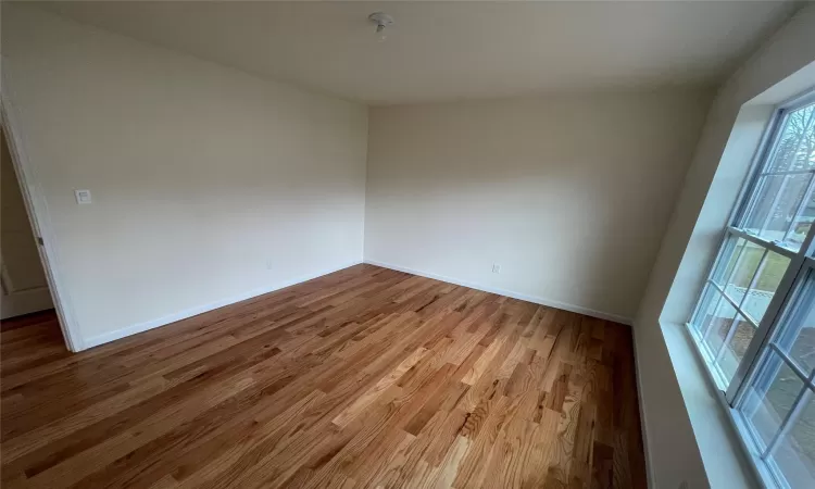 Unfurnished room with light hardwood / wood-style flooring