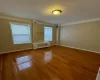 Spare room featuring wood-type flooring