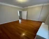 Empty room with dark hardwood / wood-style floors