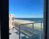 Balcony with a water view and a beach view