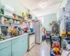 Kitchen with white appliances and tasteful backsplash