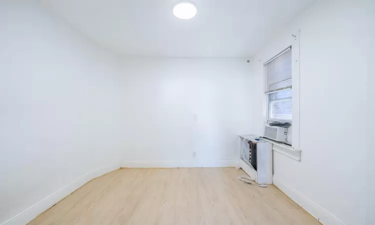 Kitchen featuring light hardwood / wood-style flooring and cooling unit