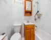 Full bathroom featuring vanity, toilet, and shower / bath combination