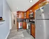 Kitchen featuring decorative backsplash, stainless steel appliances, and sink