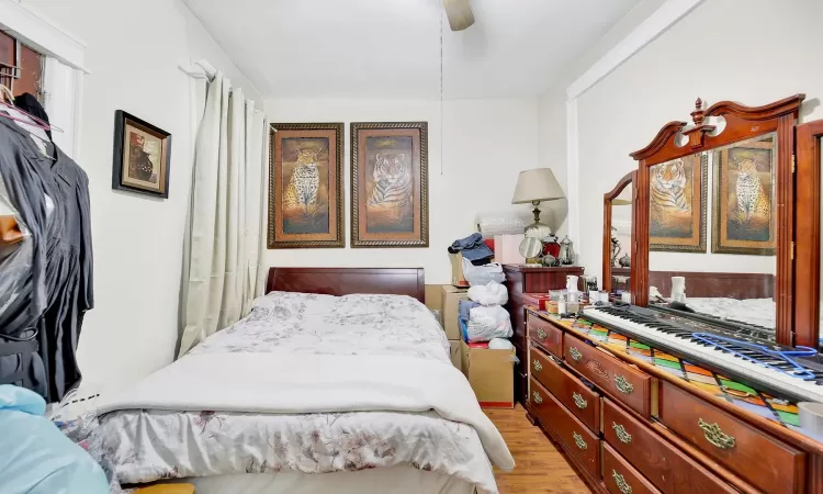 Bedroom featuring ceiling fan and light hardwood / wood-style floors