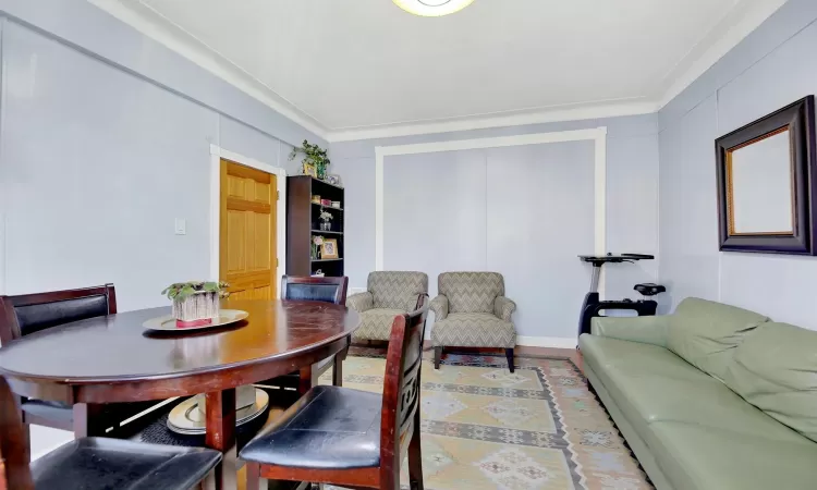 Dining space featuring ornamental molding