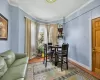 Dining area featuring hardwood / wood-style flooring and crown molding