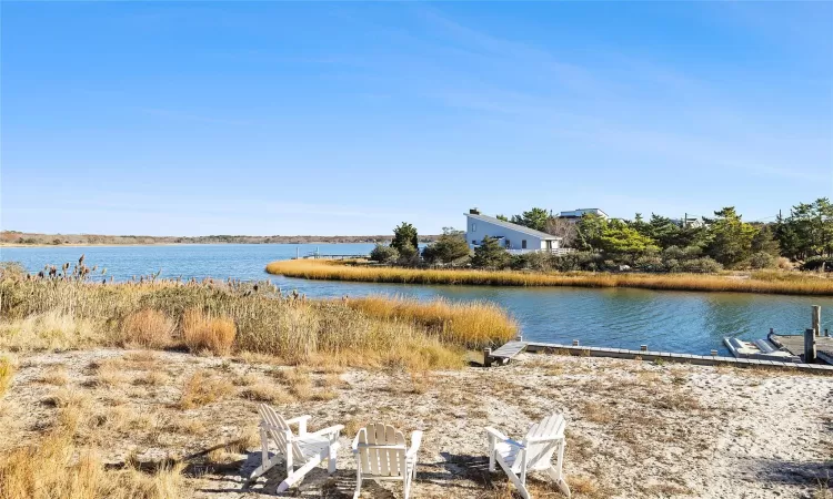 Waterfrontbulkheaded backyard with dock and jet ski pad