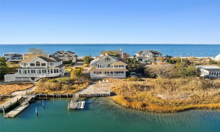 Aerial view featuring a water view and dock