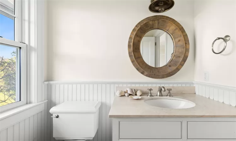 Bathroom featuring vanity and toilet