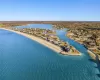 Bird's eye view featuring a view of the beach and a water view