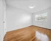 Unfurnished room with light hardwood / wood-style flooring and a baseboard heating unit