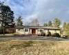 Single story home featuring a front yard