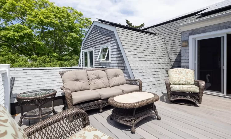 Wooden terrace with outdoor lounge area