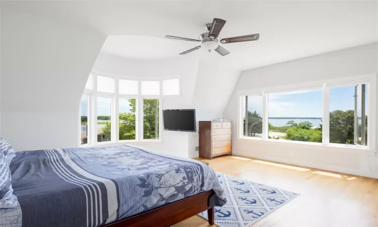 Bedroom featuring light hardwood / wood-style flooring and ceiling fan