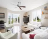 Living room featuring ceiling fan and light hardwood / wood-style flooring