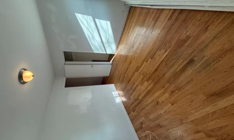 Empty room featuring hardwood / wood-style floors