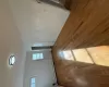 Empty room featuring light wood-type flooring and a baseboard heating unit