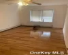 Empty room with hardwood / wood-style flooring