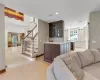 View from Den of Wet Bar, Entrance Foyer, Kitchen Entrance and Formal Living Room