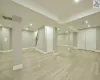 Basement featuring light hardwood / wood-style flooring