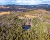 Bird's eye view featuring a water and mountain view