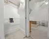 Bathroom with ceiling fan and lofted ceiling