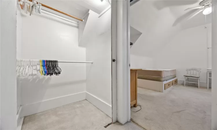 Bathroom with ceiling fan and lofted ceiling