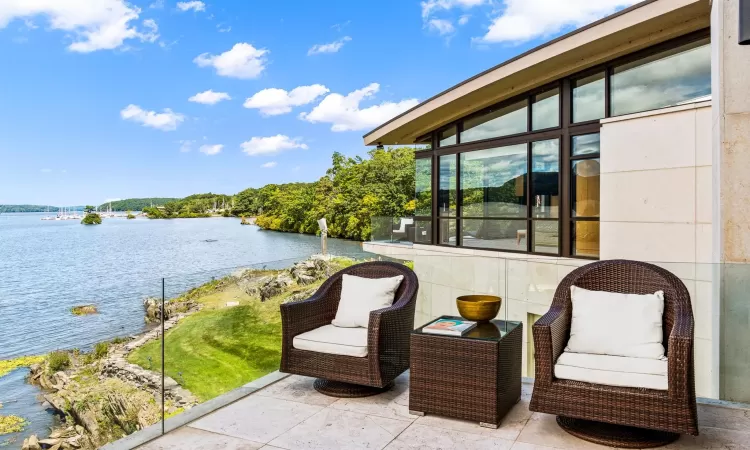 View of patio / terrace featuring a water view