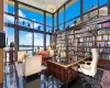 Office with a water view, a wall of windows, and a high ceiling