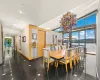 Dining area with expansive windows, plenty of natural light, and a water view