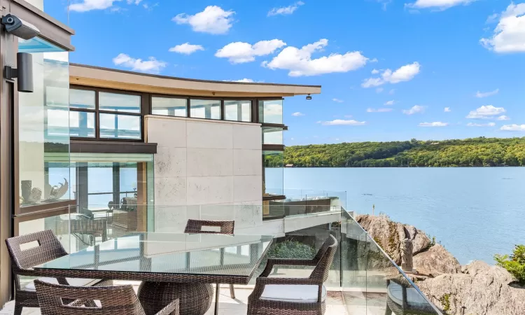 View of patio / terrace featuring a water view