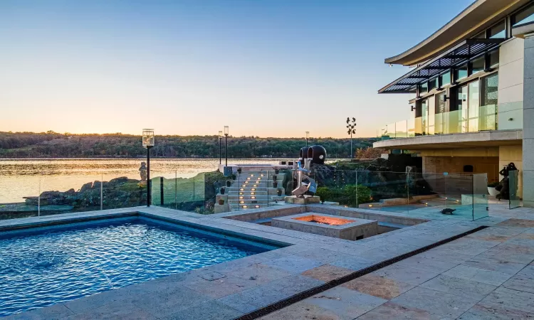 View of pool at dusk