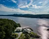 Birds eye view of property with a water and mountain view