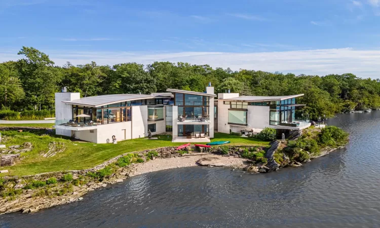 Rear view of house featuring a water view