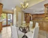 Tiled dining space with a notable chandelier