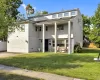 View of front facade featuring a patio and a front lawn