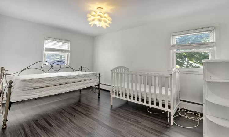 Bedroom featuring dark wood-type flooring