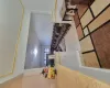 Kitchen with crown molding, light hardwood / wood-style floors, and a textured ceiling